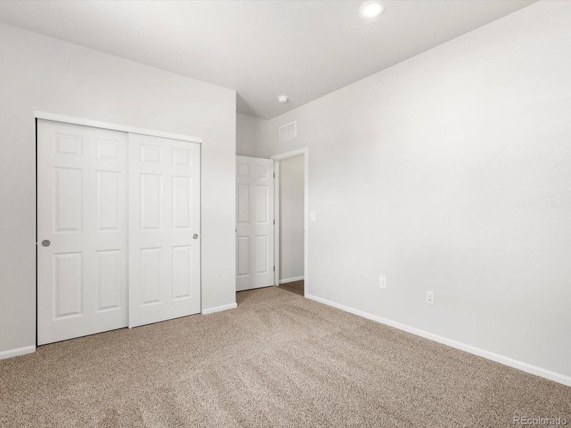 Spacious, unfurnished interior of a new home in Poudre Heights: The Alpine Collection, Windsor (Image 34).