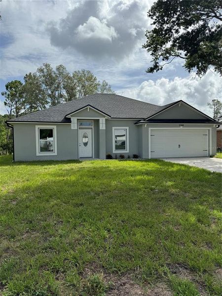 Front exterior of a new home in , Deltona, FL, highlighting curb appeal (Image 23).