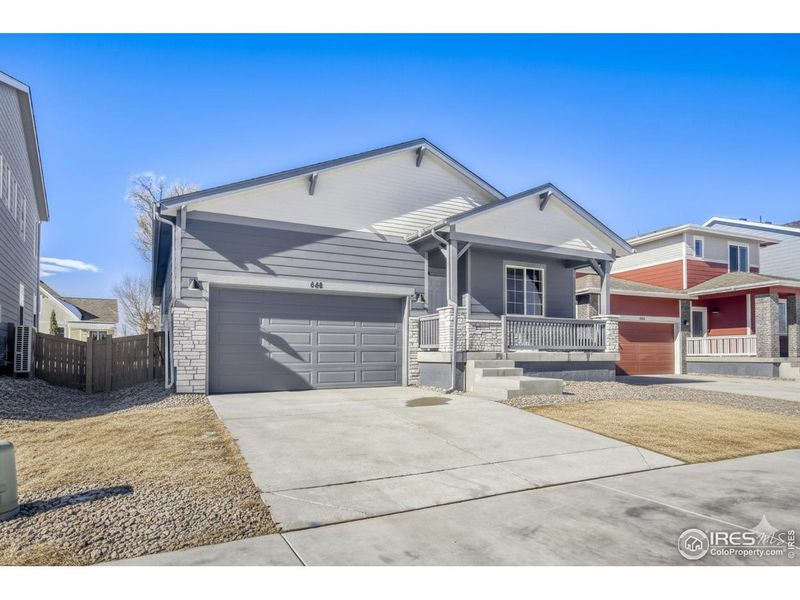 Front exterior of a new home in Trevenna, Windsor, CO, highlighting curb appeal (Image 1). Front exterior of a new home in Trevenna, Windsor, CO, highlighting curb appeal (Image 1).