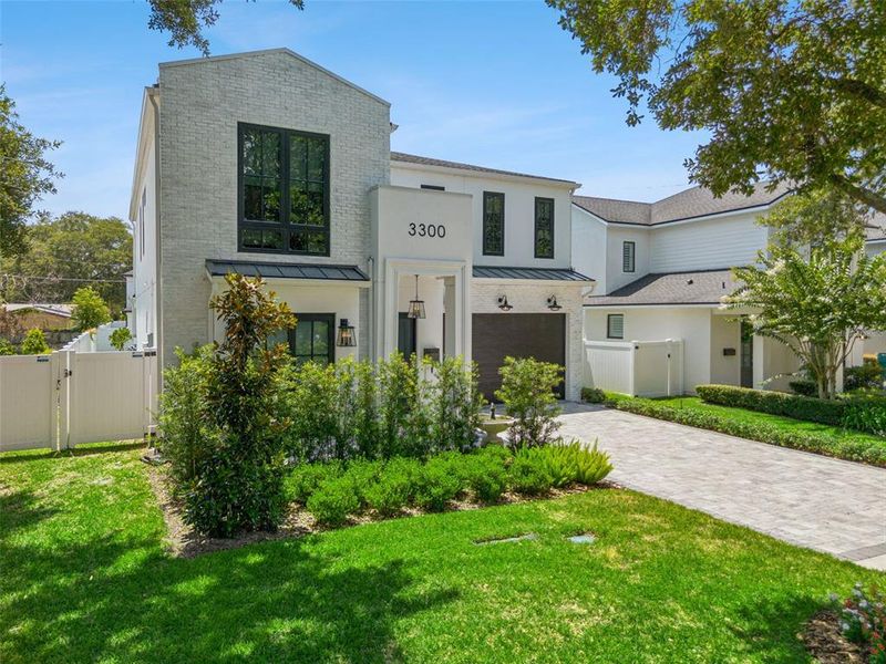 Front exterior of a new home in , Orlando, FL, highlighting curb appeal (Image 2).