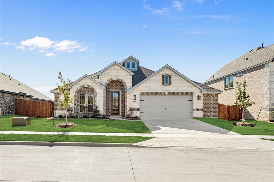 Front exterior of a new home in Maplewood, Glenn Heights, TX, highlighting curb appeal (Image 1).