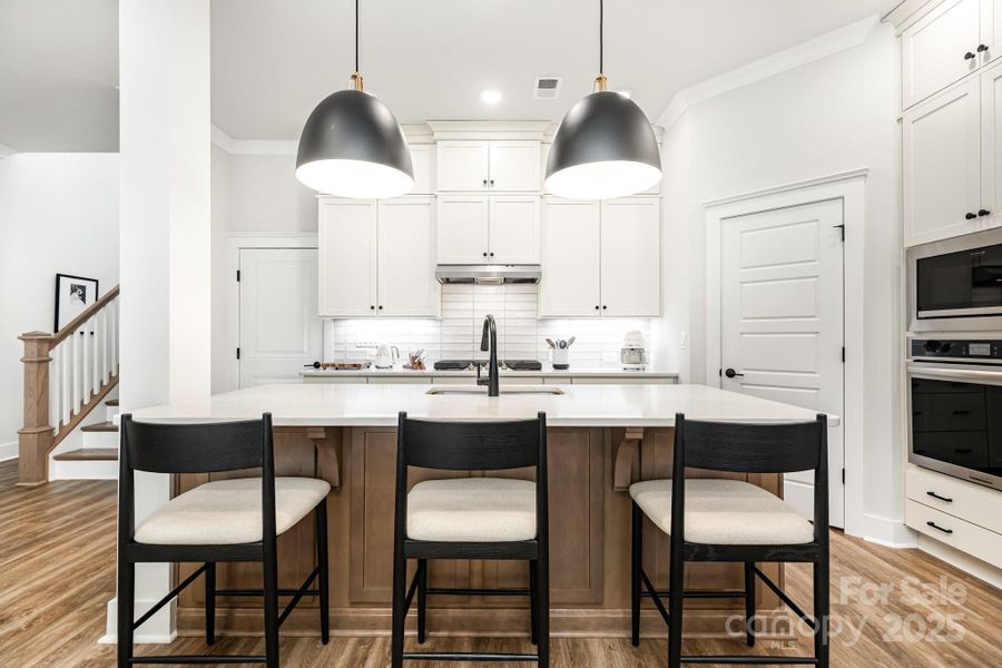 Enjoy a Chef's kitchen with gas stove and floor to ceiling cabinetry.