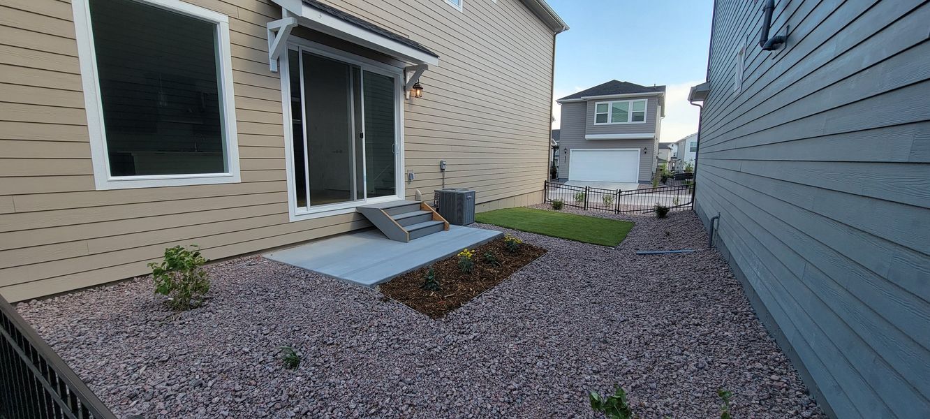 Exterior details and patio area of a home in Revel Crossing at Wolf Ranch – The Ascent Collection, Colorado Springs (Image 3).