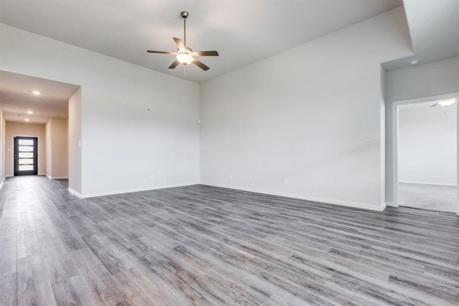 Spare room featuring a ceiling fan, light wood-type flooring, and recessed lighting