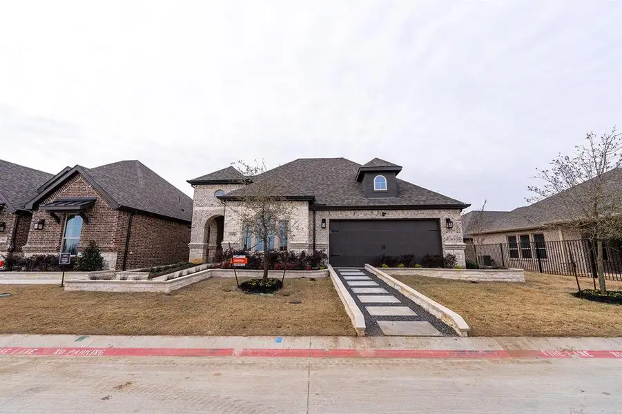 Front exterior of a new home in , Little Elm, TX, highlighting curb appeal (Image 1).