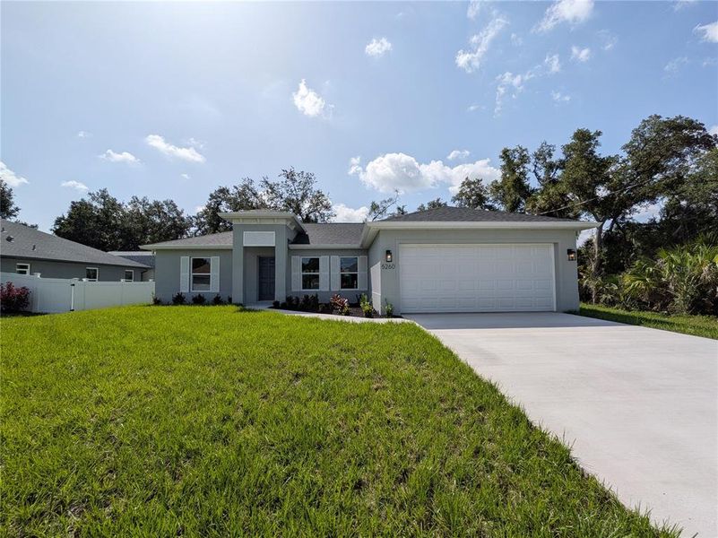 Front exterior of a new home in , North Port, FL, highlighting curb appeal (Image 1). Front exterior of a new home in , North Port, FL, highlighting curb appeal (Image 1).