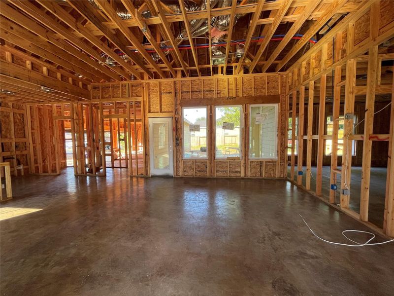 Large Family room with picture windows to allow in the Natural lighting or a view of the backyard.