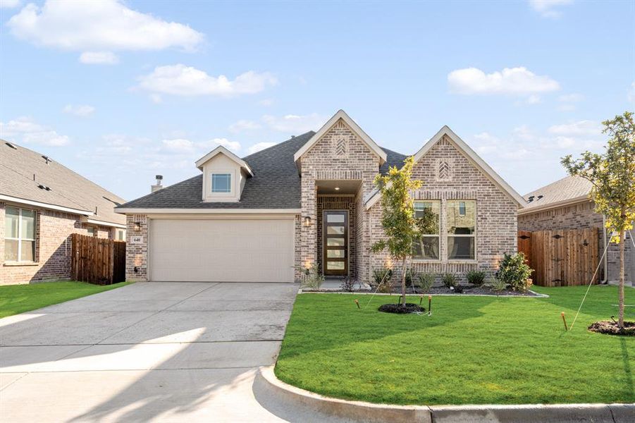 Front exterior of a new home in Godley Ranch Classic, Godley, TX, highlighting curb appeal (Image 1).