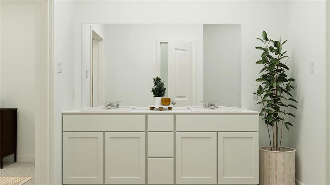 Bathroom featuring double vanity, a sink, and baseboards