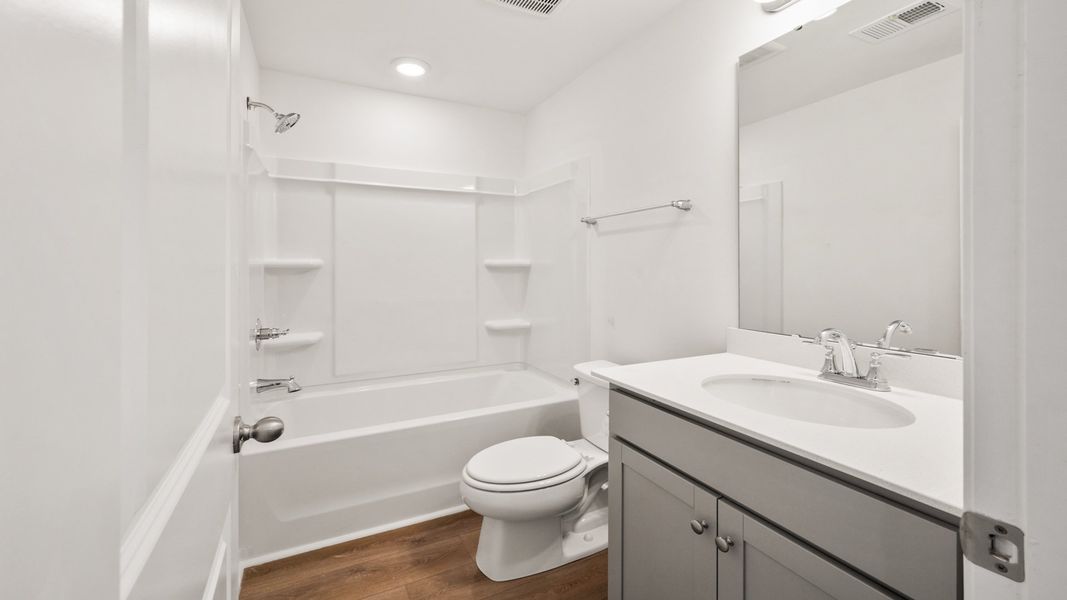 Bathroom with shower in the Hayden Floorplan at Clear Springs Townhomes