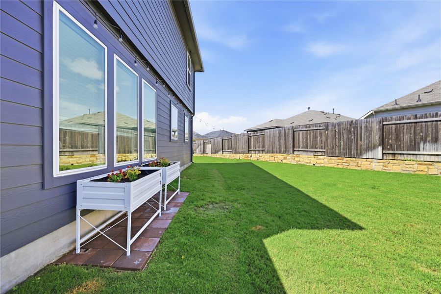 Exterior details and patio area of a home in Sunfield, Buda (Image 24).