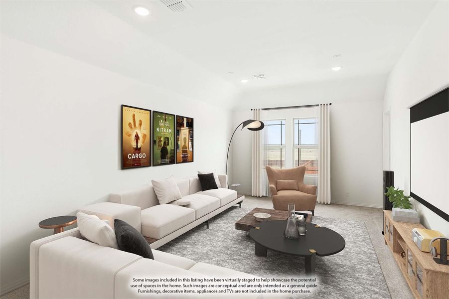 Bonus room or media room with sectional sofa, large projection screen, and movie posters on white walls