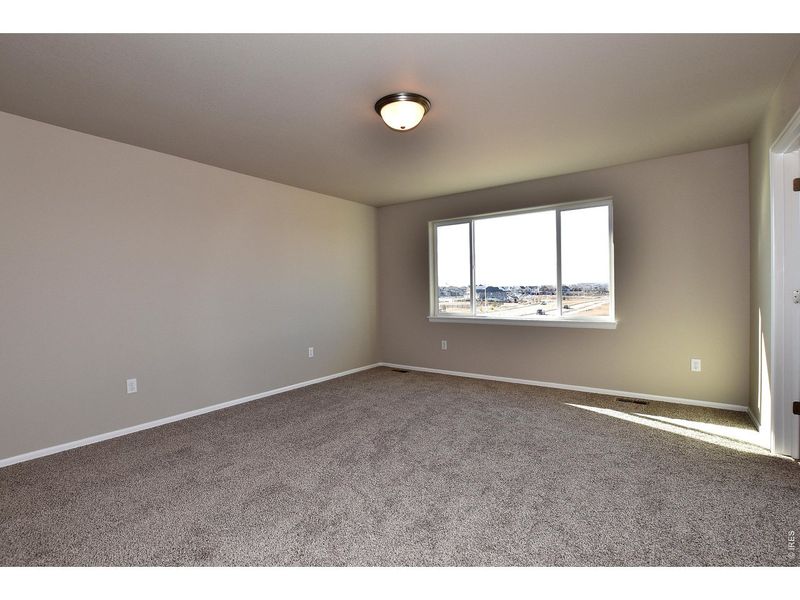 Spacious, unfurnished interior of a new home in Union Colony West, Greeley (Image 20).