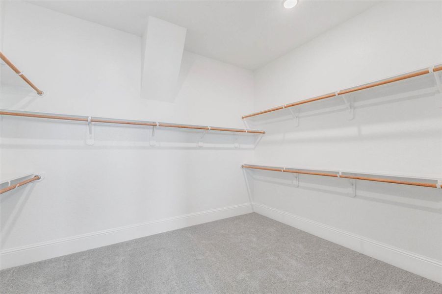 Spacious, walk-in closet offers ample storage.
