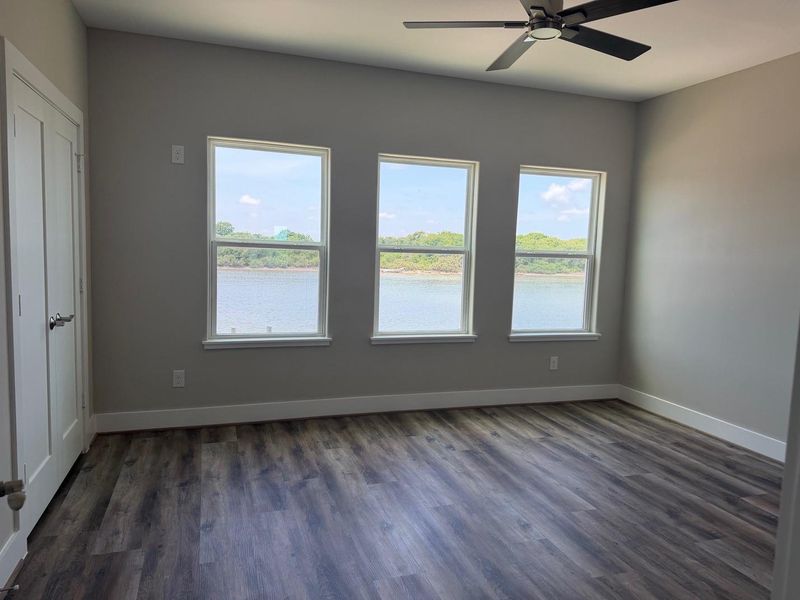 Abundant natural lighting with views of the  Colorado River.1st Floor Primary Bedroom