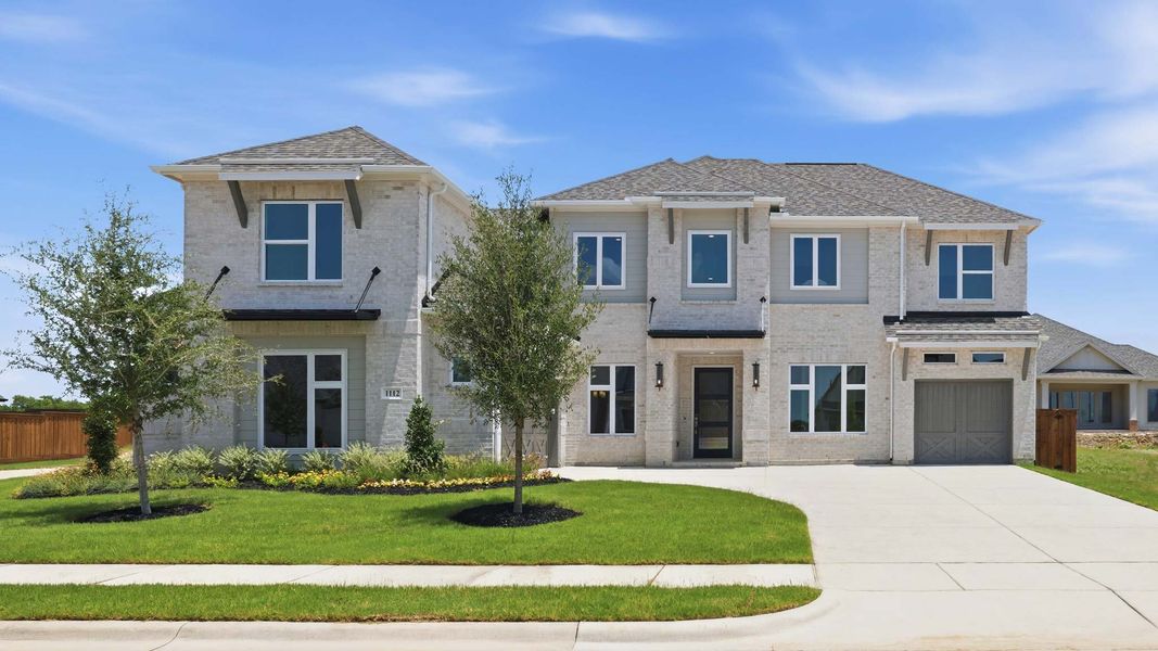 Front exterior of a new home in Terraces, Rockwall, TX, highlighting curb appeal (Image 1). Front exterior of a new home in Terraces, Rockwall, TX, highlighting curb appeal (Image 1).