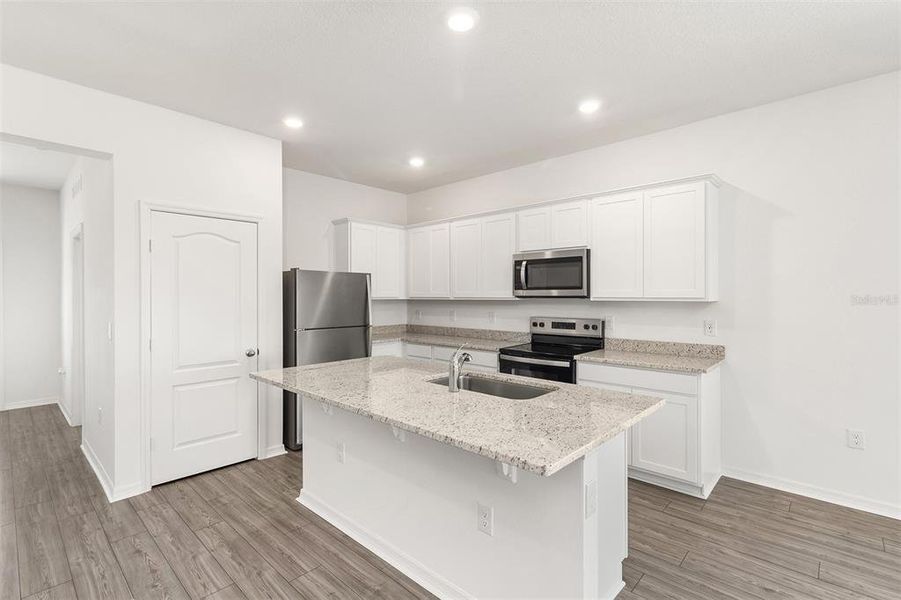 Furnished interior view inside a new home in Peach Crossings, Winter Haven (Image 5).