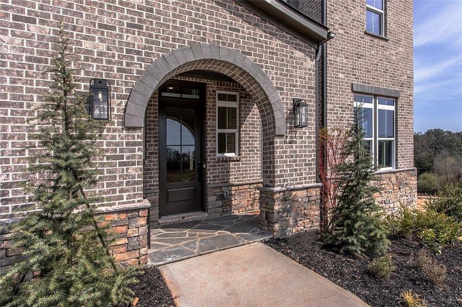 Exterior details and patio area of a home in Estates at Daves Creek, Cumming (Image 4). Exterior details and patio area of a home in Estates at Daves Creek, Cumming (Image 4).