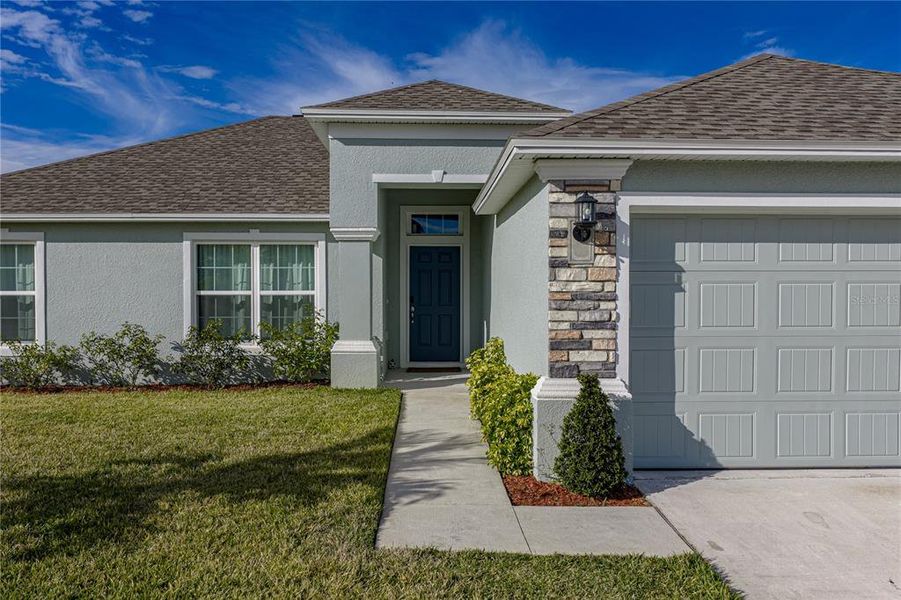 Front exterior of a new home in , Sebring, FL, highlighting curb appeal (Image 24).