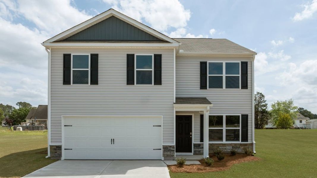 Front exterior of a new home in Blair Ridge, La Grange, NC, highlighting curb appeal (Image 1). Front exterior of a new home in Blair Ridge, La Grange, NC, highlighting curb appeal (Image 1).