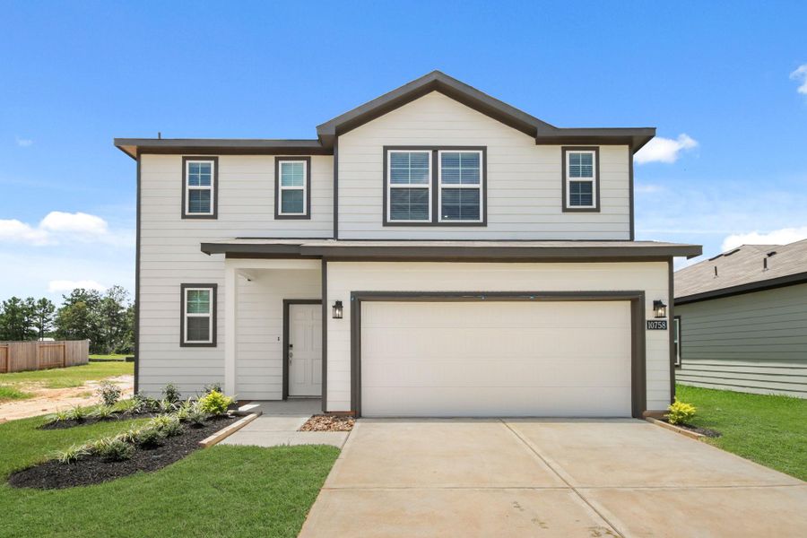Front exterior of a new home in Crockett Meadows, Conroe, TX, highlighting curb appeal (Image 17).