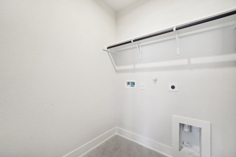 Laundry room in the Medina floorplan at a Meritage Homes community.