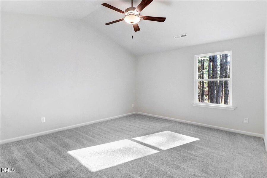 09-Owner_s suite bedroom with ceiling fa