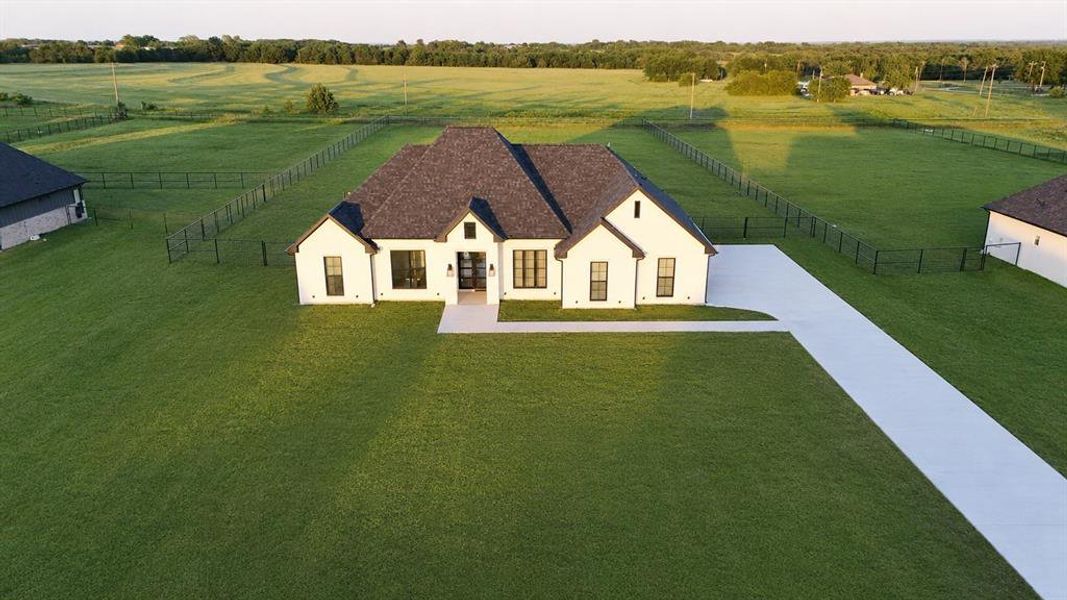 Front exterior of a new home in , Whitesboro, TX, highlighting curb appeal (Image 2). Front exterior of a new home in , Whitesboro, TX, highlighting curb appeal (Image 2).