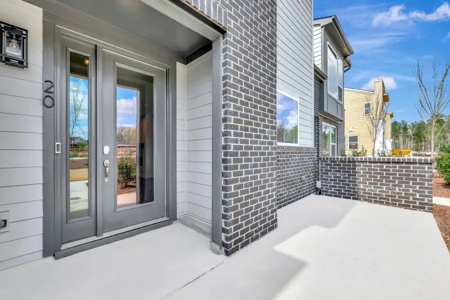 Exterior details and patio area of a home in The Townes at NoVi, Pittsboro (Image 3). Exterior details and patio area of a home in The Townes at NoVi, Pittsboro (Image 3).
