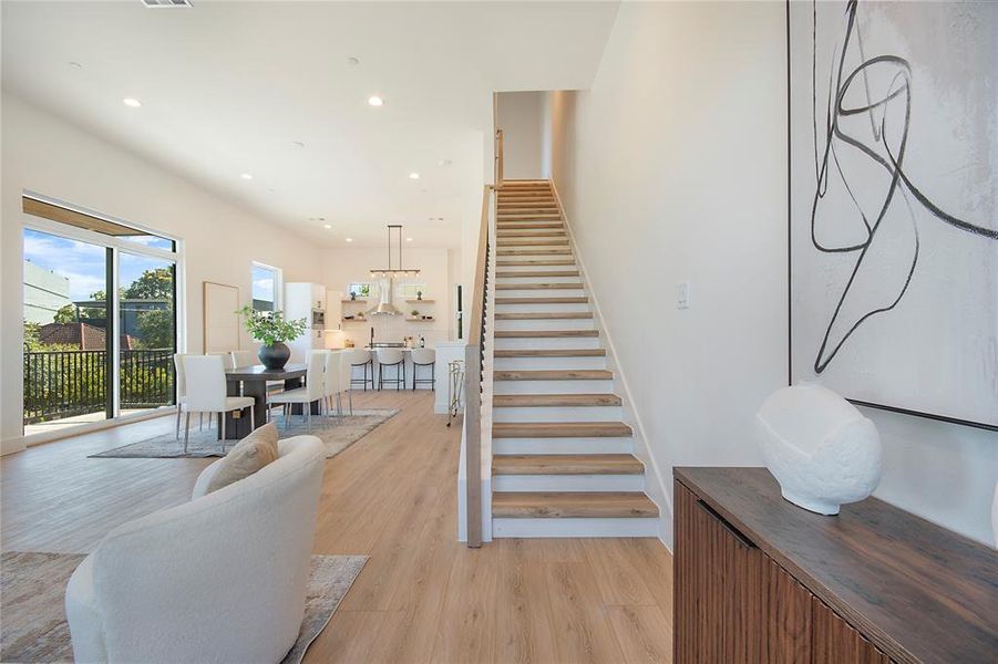 Stairway with wood finished floors and recessed lighting Stairway with wood finished floors and recessed lighting