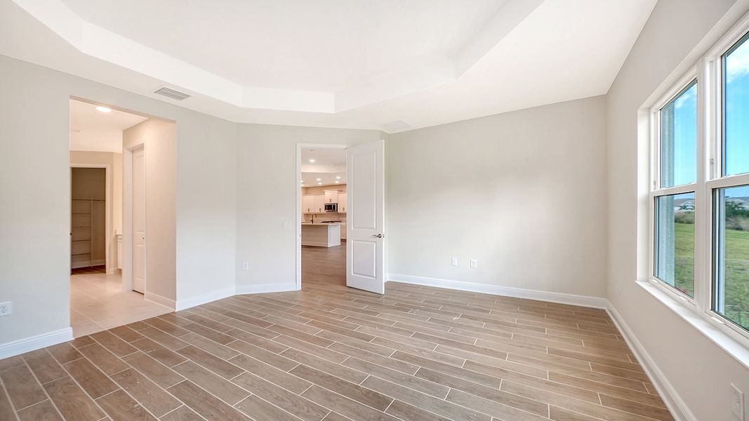 Spacious, unfurnished interior of a new home in Grand Park Real Estate and Homes for Sale in Sarasota, FL - Neal Communities, Sarasota (Image 41).