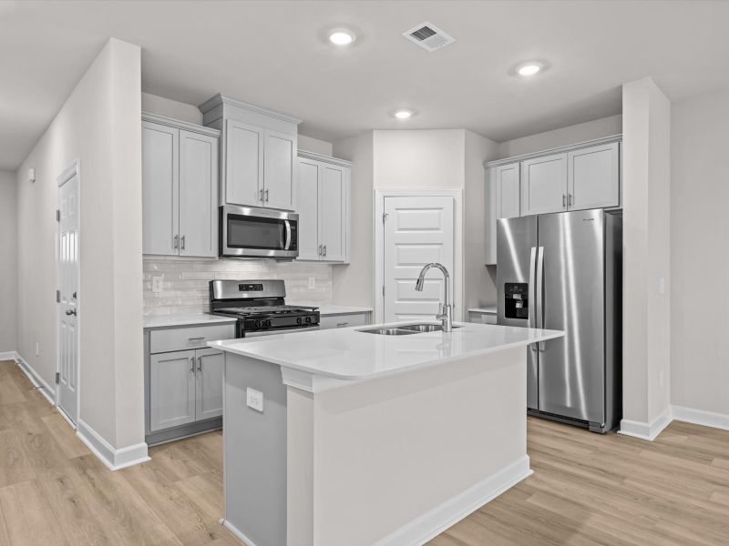 Furnished interior view inside a new home in Crossing at Abner Creek Townes, Greer (Image 4).