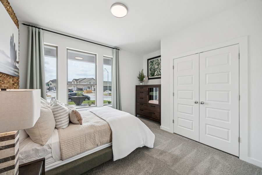 Bedroom in the Trinity home plan by Trophy Signature Homes – REPRESENTATIVE PHOTO