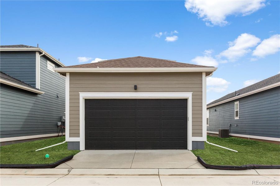 Front exterior of a new home in Timnath Lakes, Timnath, CO, highlighting curb appeal (Image 13).