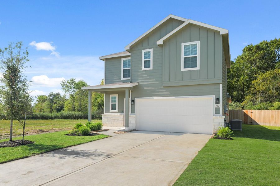 Front exterior of a new home in The Villages at Westpointe, Dayton, TX, highlighting curb appeal (Image 15). Front exterior of a new home in The Villages at Westpointe, Dayton, TX, highlighting curb appeal (Image 15).