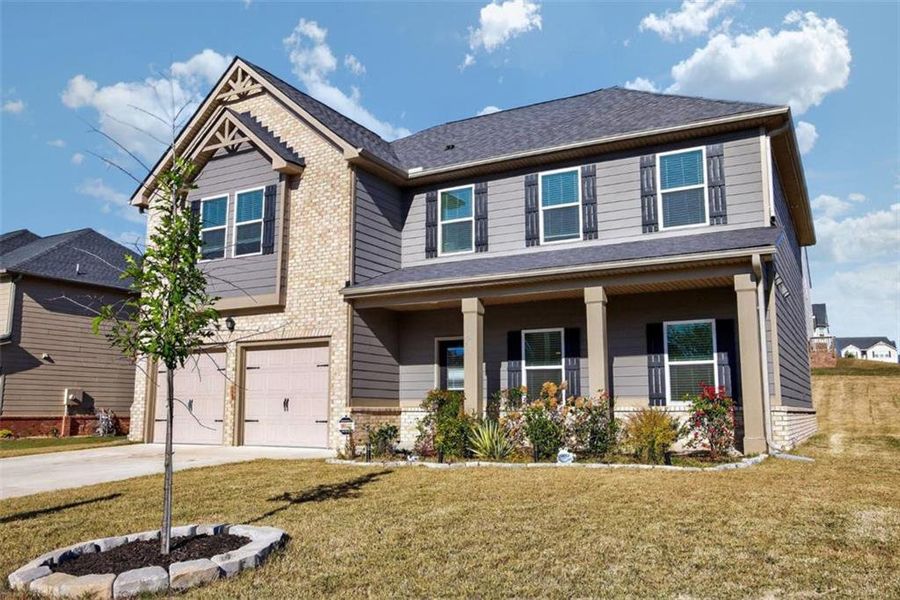 Front exterior of a new home in The Enclave at Dial Farm Phase III, Walnut Grove, GA, highlighting curb appeal (Image 1).