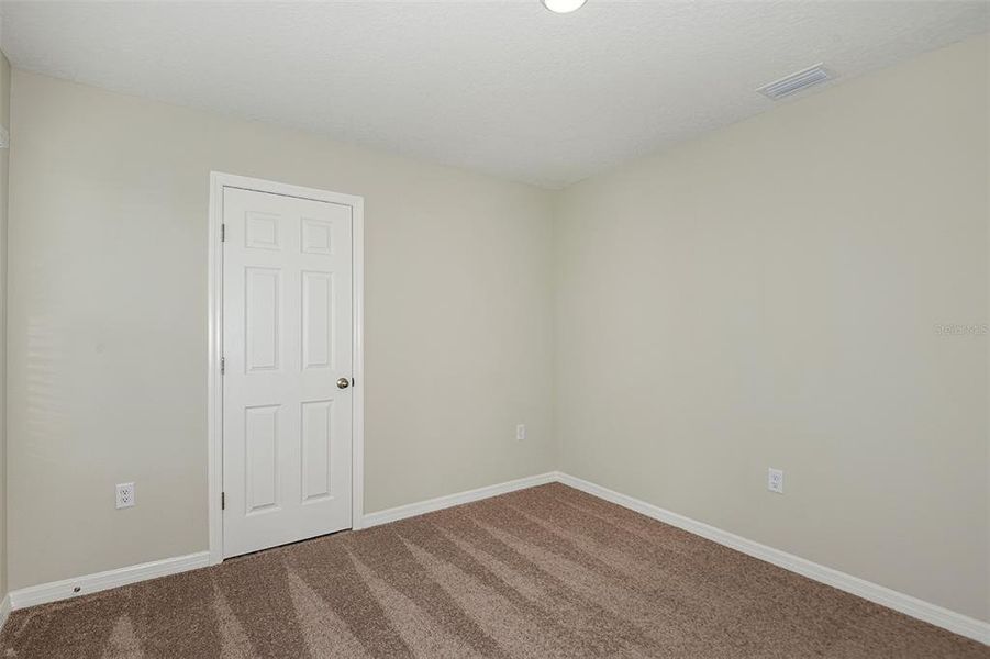 Spacious, unfurnished interior of a new home in Scenic Terrace, Haines City (Image 22).