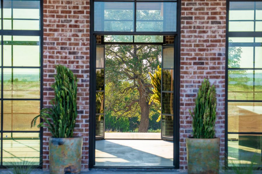 Entrance to property with brick siding
