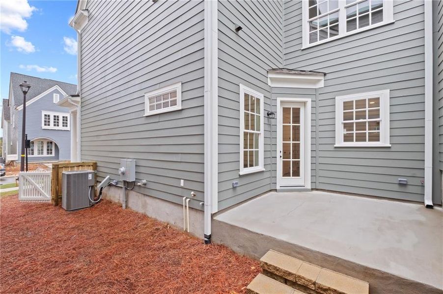 Front exterior of a new home in , Woodstock, GA, highlighting curb appeal (Image 21).