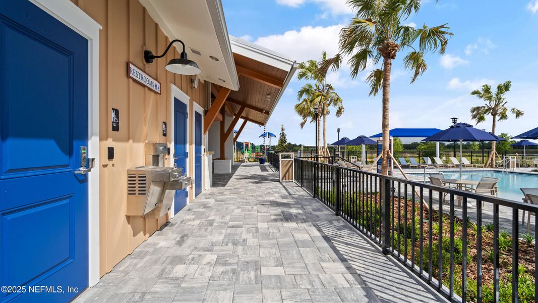 Front exterior of a new home in Lakes at Bella Lago - Signature Series, Green Cove Springs, FL, highlighting curb appeal (Image 1).
