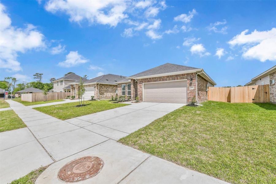 Front exterior of a new home in King Oaks Village, Baytown, TX, highlighting curb appeal (Image 18).