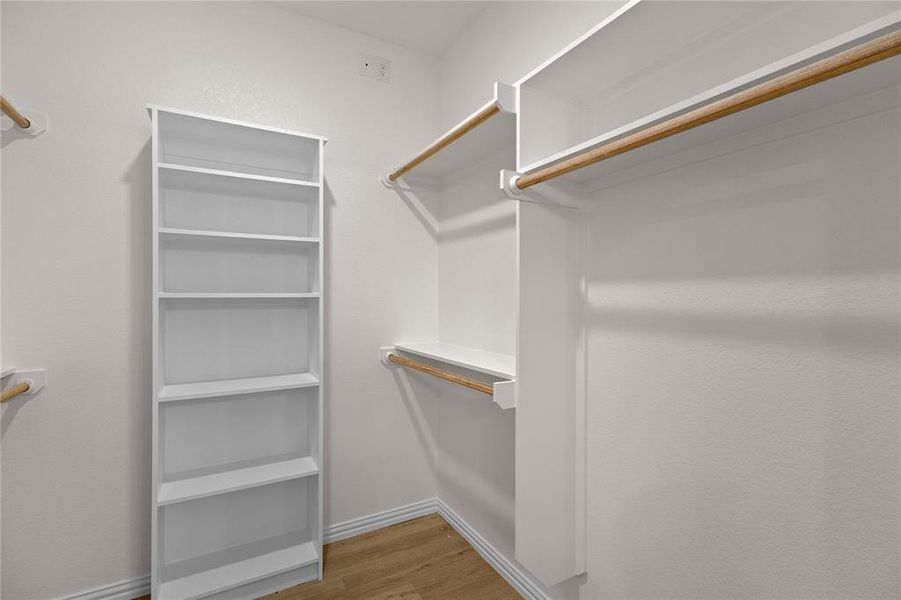 Walk in closet featuring light wood-style flooring
