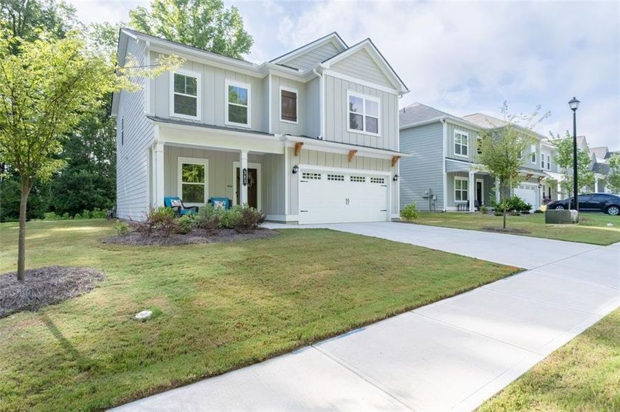 Front exterior of a new home in Morgan Landing, Carrollton, GA, highlighting curb appeal (Image 31). Front exterior of a new home in Morgan Landing, Carrollton, GA, highlighting curb appeal (Image 31).