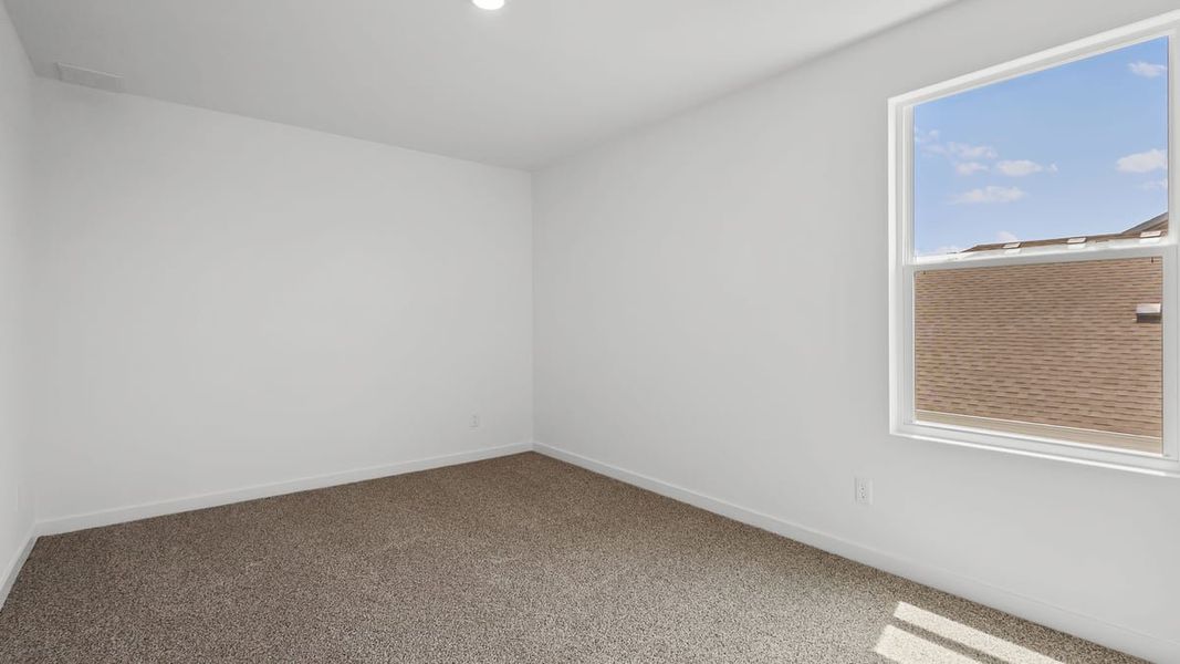 Representative unfurnished interior of a home built from the Holcombe by D.R. Horton in Peachtree Meadows, Rockwall (Image 23).