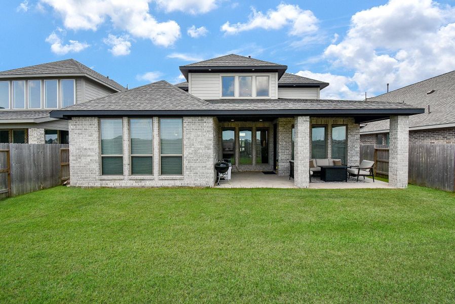 Front exterior of a new home in Stonecreek Estates 50', Richmond, TX, highlighting curb appeal (Image 23).