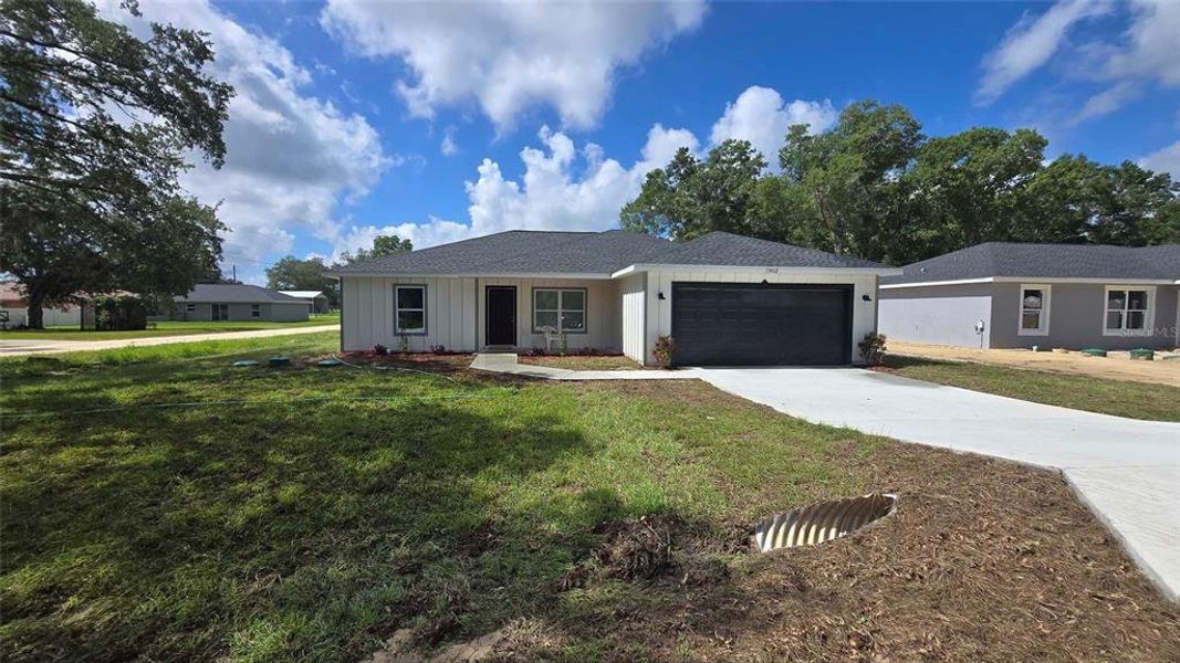 Front exterior of a new home in , Dunnellon, FL, highlighting curb appeal (Image 35).