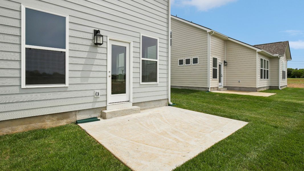 Large Backyard of home with small back patio