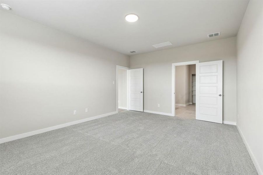 Primary Suite in the Winters home plan by Trophy Signature Homes – REPRESENTATIVE PHOTO