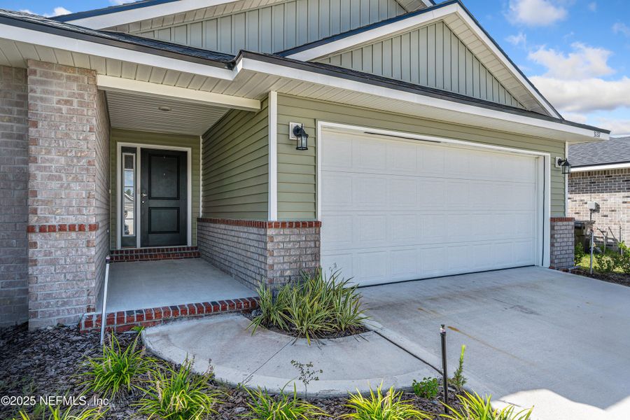 Front exterior of a new home in Shadow Crest at Rolling Hills, Green Cove Springs, FL, highlighting curb appeal (Image 21).