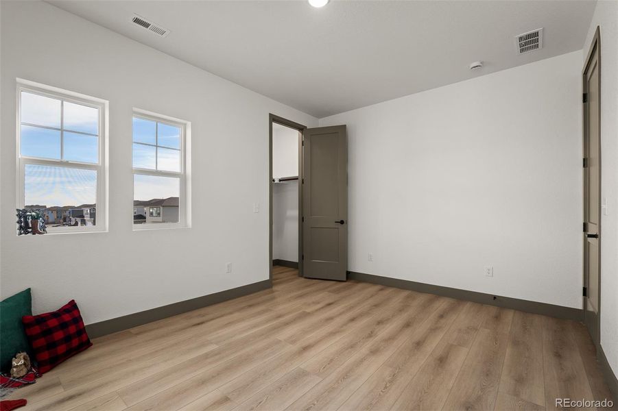 Spacious, unfurnished interior of a new home in Revel Crossing at Wolf Ranch - The Panorama Collection, Colorado Springs (Image 22).